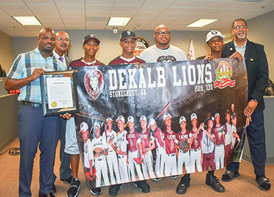 Councilman George Turner and Mayor Jason Lary honors accomplishments of DeKalb Lions youth baseball team.